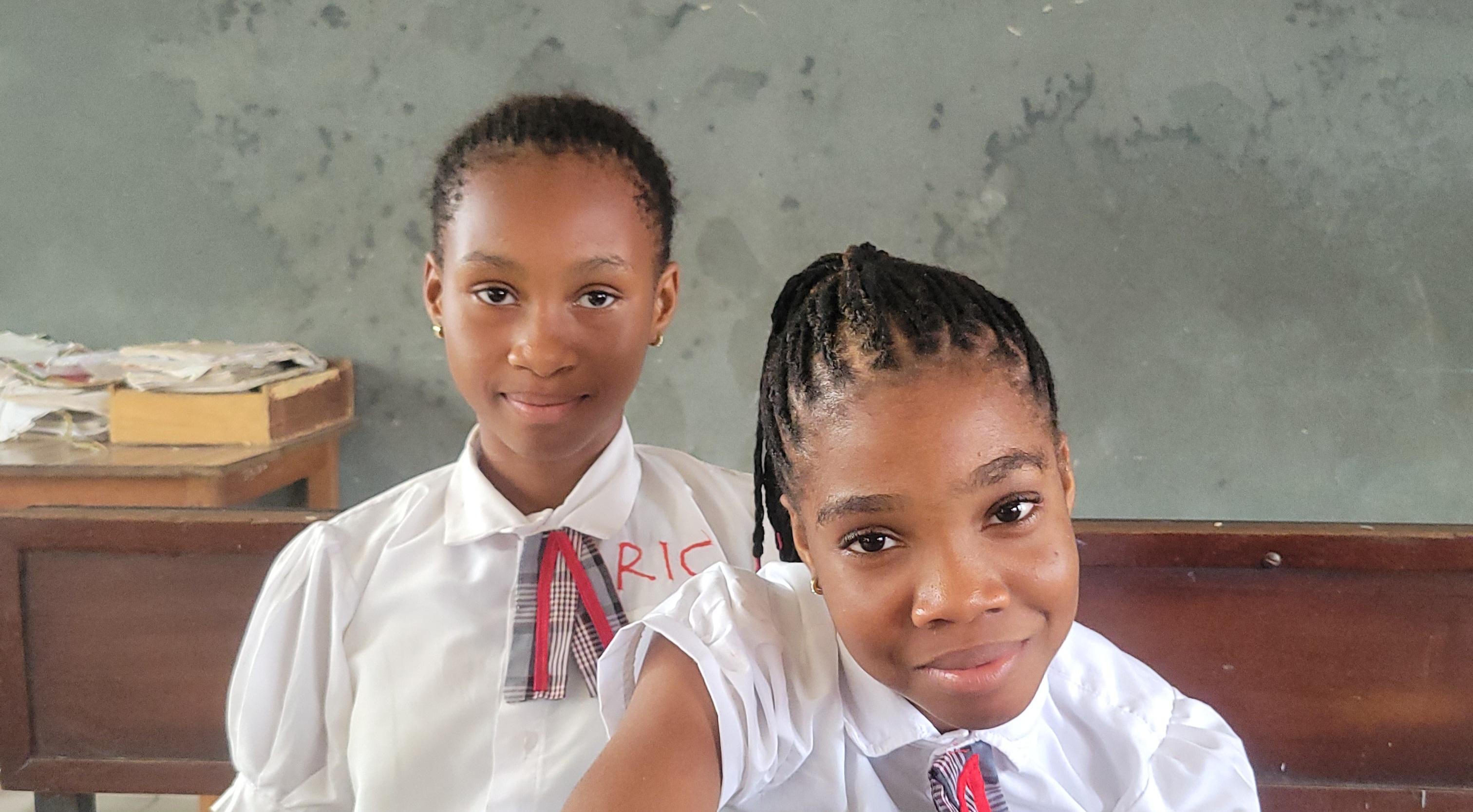 students sitted in a classroom smiling